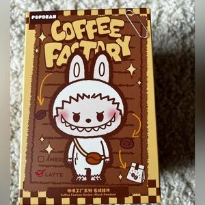 Pop Mart – Pop Bean Coffee Factory Series Pendant: Labubu Coffee Bean Grinder: